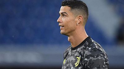 Soccer-Manchester United re-sign Ronaldo from Juventus