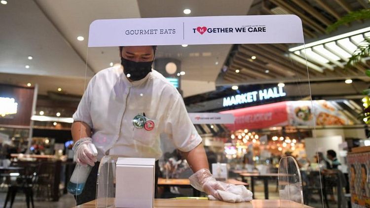 Hair cuts and dining in as Thai malls reopen after virus cases ease