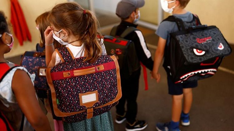 Facemasks and sanitizer as French kids go back to school