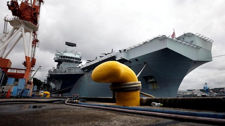 Britain shows off Queen Elizabeth aircraft carrier to anxious Japan