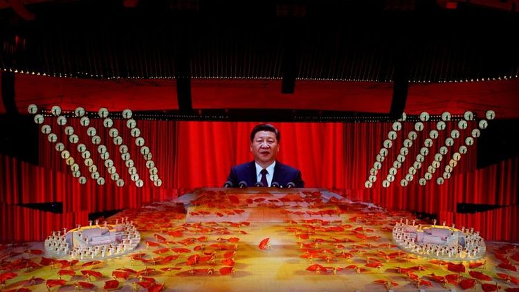 Analysis-Unleashing reforms, Xi returns to China's socialist roots