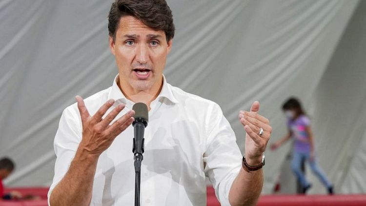 Canada's Trudeau, trailing in polls, defends early election call
