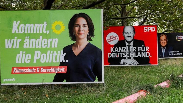 German leadership hopefuls clash on TV over money-laundering raids, far-left