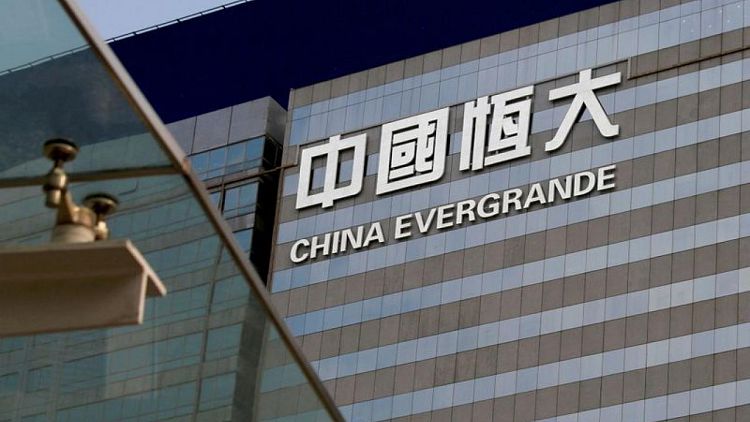 Embattled China Evergrande warns of cross-default, liquidity crunch