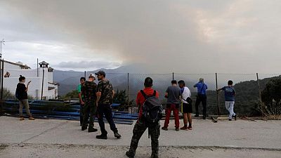 Las lluvias ayudan a controlar un devastador incendio en España Las lluvias ayudan a controlar un devastador incendio en España