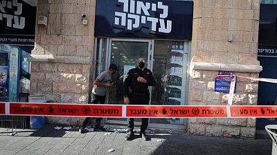 Palestinian stabs two in Jerusalem shop before being shot, Israeli police say Palestinian stabs two in Jerusalem shop before being shot, Israeli police say
