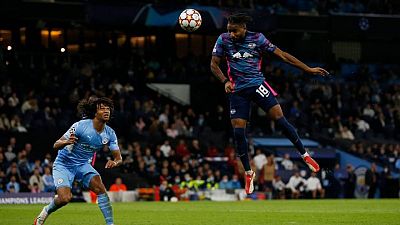 Soccer-Man City survive Nkunku hat-trick to overwhelm Leipzig 6-3