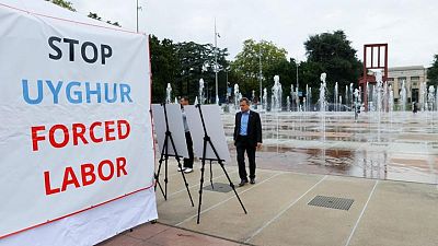 'Wall of the Disappeared': U.S.-backed Uyghur exhibit opens in Geneva