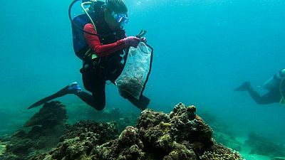 Philippines divers clear plastic waste from corals for World Cleanup Day