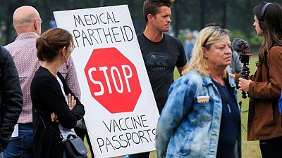 Dutch marchers protest new COVID-19 pass to enter bars, restaurants Dutch marchers protest new COVID-19 pass to enter bars, restaurants