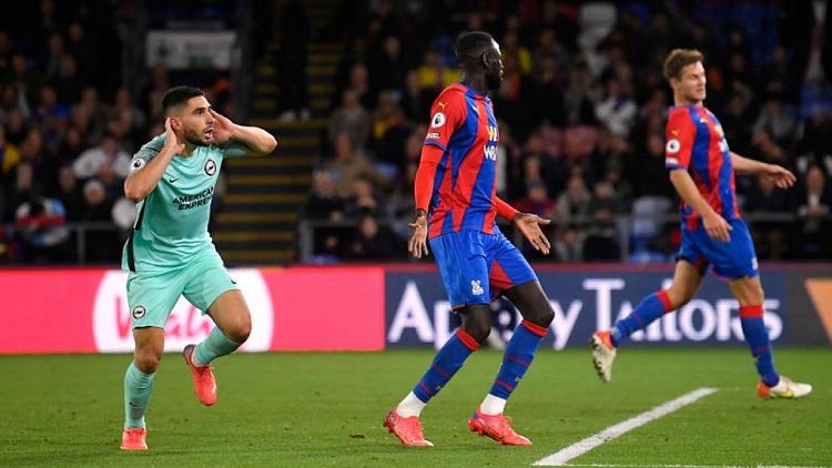 Soccer-Brighton earn last-gasp draw at Palace but denied top spot