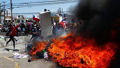 'They yell ugly things': Migrants in Chile's north fearful after fiery protests