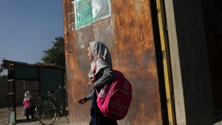 Afghan girls stuck at home, waiting for Taliban plan to re-open schools