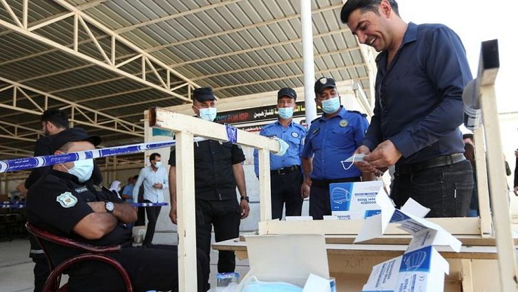 Soldiers, prisoners, displaced people vote early ahead of Iraq election