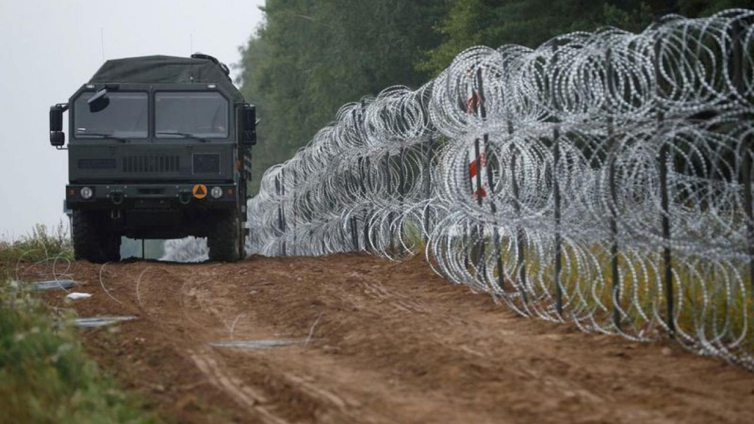 Poland says Belarusian services fired towards its troops