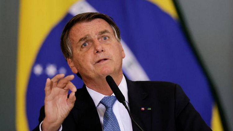 Brazil's unvaccinated president misses soccer match