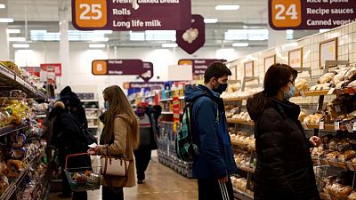 UK shoppers shrug off inflation worries to pick up their spending
