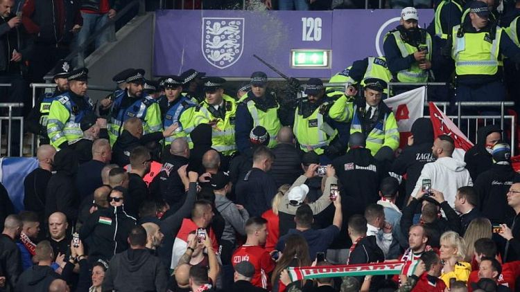 Soccer-FIFA condemn 'abhorrent' violence at Wembley