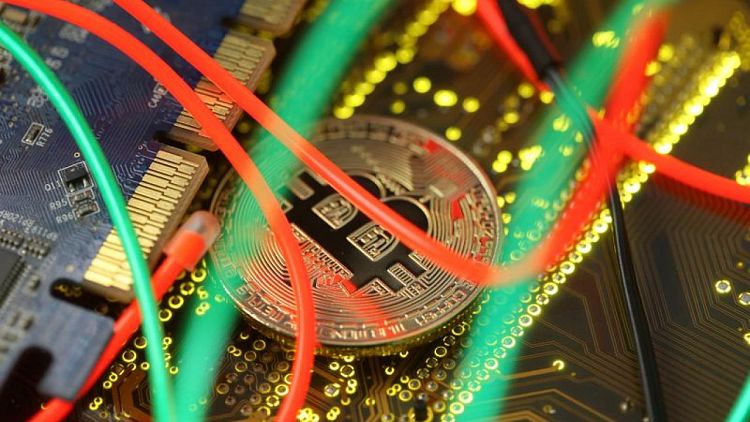 Bitcoin hovers near 6-month high on ETF hopes, inflation worries