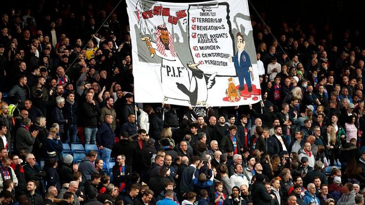 Soccer-Police to investigate banner at Crystal Palace critical of Newcastle deal