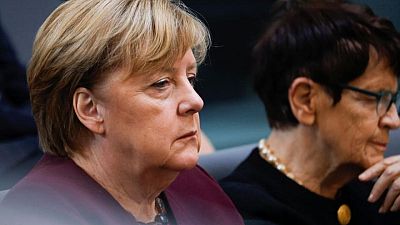 Merkel looks on as new-era parliament convenes