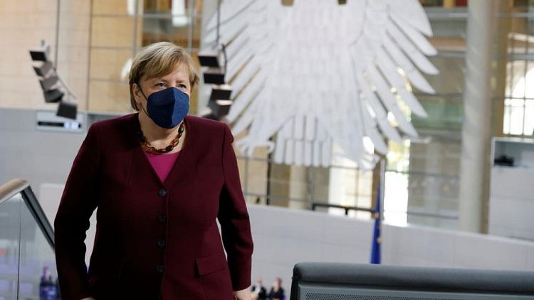 Merkel looks on as new-era parliament convenes