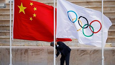 Beijing marks 100 days to Winter Olympics amid COVID, rights concerns