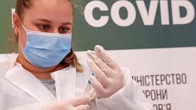 As COVID-19 toll surges, Ukraine cracks down on fake vaccination certificates