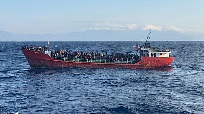 Ship with hundreds of Afghan migrants docks at Greek port