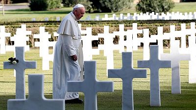 Pope, at military cemetery, tells arms manufacturers: 'Stop!'