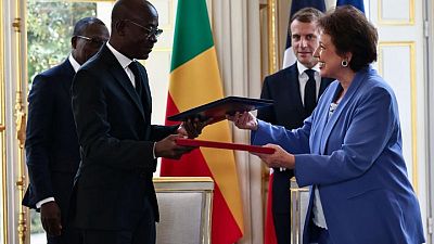 France officially signs over artworks taken from ex-colony Benin