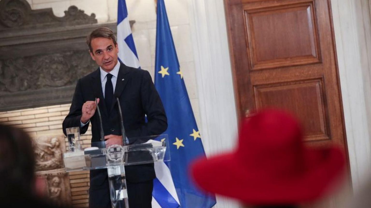 Greek PM defends migration policy in heated exchange with journalist