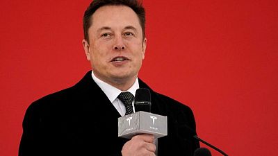 Elon Musk spars with Bernie Sanders, offers to sell more Tesla stock