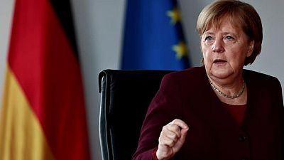 Exclusive-Merkel defends nuclear power exit, despite climate challenges