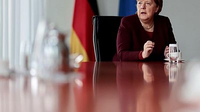 Exclusive - Merkel defends nuclear power exit, despite climate challenges