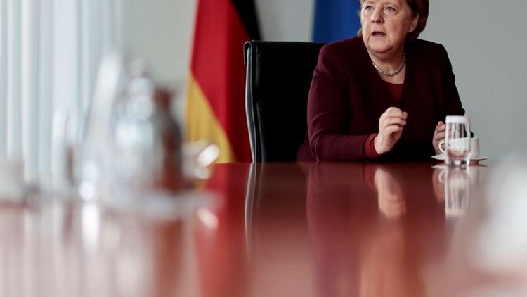 Exclusive - Merkel defends nuclear power exit, despite climate challenges