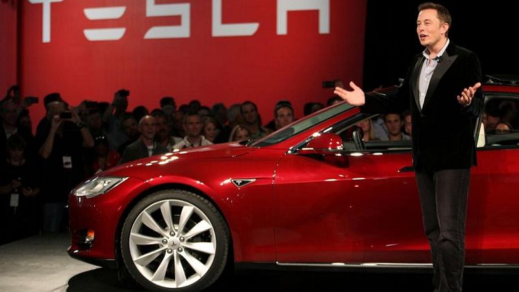 Factbox-Tesla's Musk halfway through his pledge with $9 billion stake sale