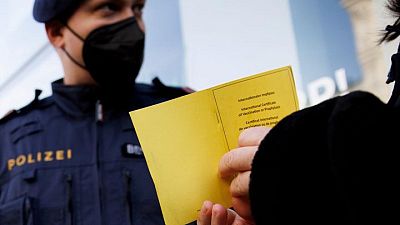 Germans, Austrians line up for vaccines as cases jump