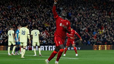 Soccer-Irresistible Liverpool thrash Arsenal 4-0 to go second