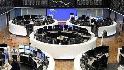 European shares tumble on COVID surge, rate hike fears
