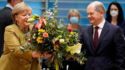 German parties near coalition deal; Merkel bids colleagues farewell