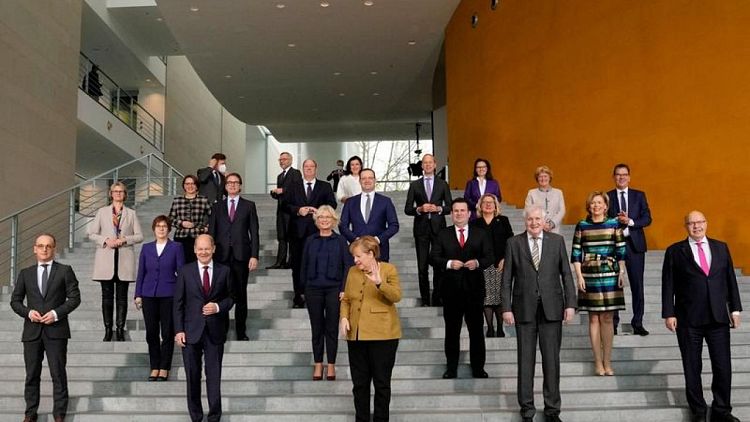 German parties near coalition deal; Merkel bids colleagues farewell