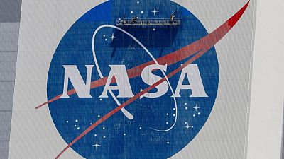 Citing debris risk, NASA delays spacewalk to fix space station antenna