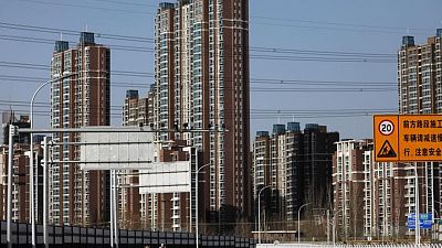 China's property woes worsen as home prices slip in November-survey