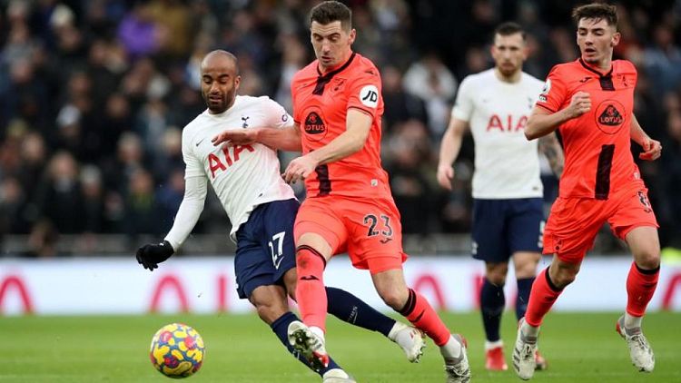 Soccer-Spurs climb to fifth with comfortable win over Norwich