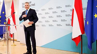 Austria's third leader in two months takes office seeking stability