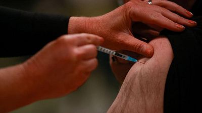 COVID-19 vaccines may be less effective against Omicron - WHO COVID-19 vaccines may be less effective against Omicron - WHO