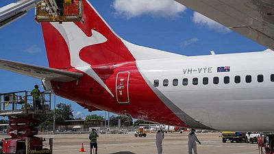 Qantas says competition to intensify, will report large H1 loss