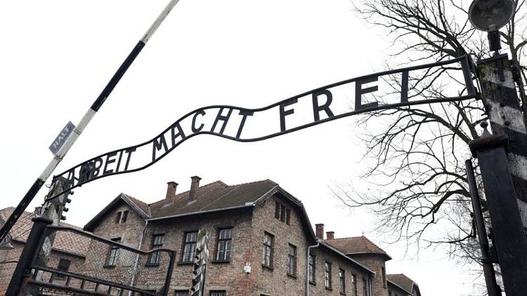 'Shameful': Auschwitz-style banner at Polish COVID vaccine protest condemned