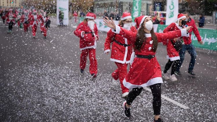 Thousands of Santas stage Madrid charity run for volcano-hit La Palma